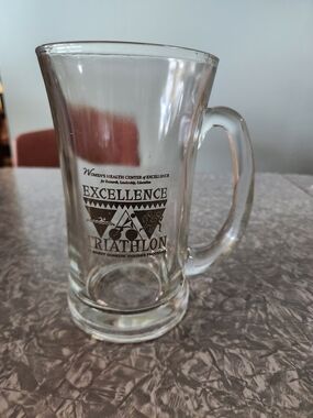 Source Unknown Clear Glass Mug with Black Excellence Triathlon Logo